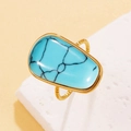 Anillo vintage dorado con piedra turquesa irregular y textura de cuerda trenzada - Turquesa