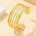 Polished gold multi-layer open cuff bracelet with seven parallel stainless steel lines - Gold