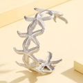 Silver starfish stainless steel open bracelet with textured ocean design for women - Steel