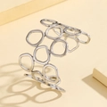 Brazalete minimalista de acero inoxidable plateado con anillos geométricos irregulares - Estilo Calado Geométrico (Z00145) / Color acero