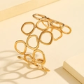 Brazalete abierto dorado con diseño geométrico hueco y anillos irregulares - Estilo Calado Geométrico (Z00145) / Dorado