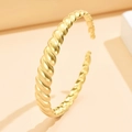 Twisted stainless steel cuff bracelet with 18K gold plating and matte finish - Gold