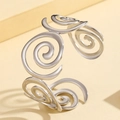 Polished silver stainless steel open bangle featuring vintage hollow spiral patterns - Silver