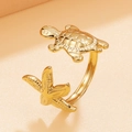 Golden stainless steel wrap ring featuring detailed starfish and sea turtle charms - Adjustable Open / Gold