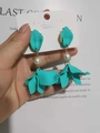 Detail of 925 silver needle drop earrings with blue frosted petals and pearl accent - Lake Blue