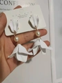 Close-up of elegant 925 silver post earrings with white 3D petals and a round pearl - White