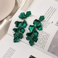 Macro shot of long emerald matte petal tassel earrings with gold chain on magazine - Emerald Green (A672)