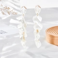 Detail of pearlescent white resin petals and gold alloy cascading tassel earrings - Cream White (A1073)