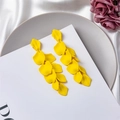 Macro shot of long layered yellow petal earrings on white silk and purple dried flowers - Yellow (Style A)