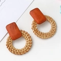 Close-up of geometric rattan earrings featuring orange wood blocks and woven circles - Dark Brown Rattan Geometric Style (A645)
