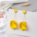 Detailed view of yellow floral drop earrings on elegant white silk and ceramic plate - Yellow (Style B)