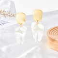 Detail view of artistic petal earrings with gold frosted studs on a silk background - Translucent White Style (A1067)