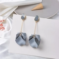 Detail of matte blue layered petal drop earrings with gold tone stems and pebble studs - Gray