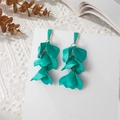 Detail of long teal petal tassel earrings with matte finish and gold metal accents - Grass Green