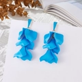 Detail showing blue leaf petal tassel drop earrings on white display card - Aquamarine