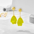 Detailed close-up of vibrant yellow petal earrings with gold studs on a display card - Yellow Petal Style (A846)