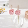 Pink floral drop earrings with gold rhinestone fringe on white satin background - Pink