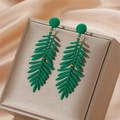 Green leaf earrings with matte finish on golden display box and silk fabric background - Matte Green (A237)