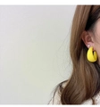 Detailed view of matte bright yellow geometric C-shaped earrings worn by a model - Bright Yellow (A323)