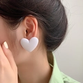 Close-up of matte white heart earring showing a large geometric 3D design on ear - White (Heart)