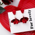 Elegant red flower petal drop earrings with central pearl on white display card - Artificial Pearl Style