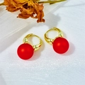 Vintage gold hoop earrings with matte red pearls on white fabric with dried flowers - Rubber Red (A551)