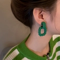Minimalist forest green geometric twist dangle earrings worn by a model in a side view - Forest Green (A383)
