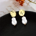 Baroque pearl drop earrings with irregular gold discs on a premium textured display - Irregular Gold Round Plate Baroque Pearl Earrings (A529)