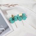 Detailed close-up of teal petal drop earrings with gold tassels on white silk - Cyan Blue