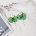 Macro detail of elegant green matte petal earrings with a slender gold pendant drop - Turquoise Green
