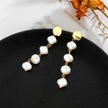 Elegant gold earrings featuring four dangling baroque pearls in a drop design - Four Linked Baroque Pearl Long Drop Earrings (A533)