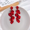 Detailed close-up of layered red petal drop earrings on a minimalist decorative display - Red (A673)