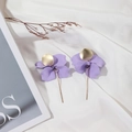 Lilac purple flower petal drop earrings with gold pendant on white silk background - Purple