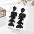 Matte black multilayered petal tassel drop earrings displayed on a white card - Black (A906)