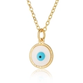 Close-up of golden necklace with circular evil eye enamel pendant and beaded edges - White