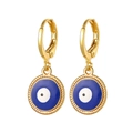 Detailed close-up of golden evil eye earrings with intricate braided edge and blue enamel - Blue