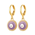 Macro detail of gold-plated evil eye earrings with lavender enamel and twisted texture - Purple