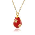 Detail of red enamel egg pendant with white floral patterns and inset cubic zirconia - Red