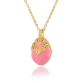 Macro detail of pink enamel egg pendant with gold-tone V-shape pattern and crystals - Pink