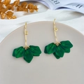 Macro shot of green petal leaf drop earrings with long gold ear hooks on a grey tray - Green (A1154)