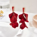 Macro detail of red vintage petal earrings with layered texture and gold hooks - Pearlescent Red