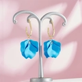 Detailed close-up of sky blue layered petal earrings with gold geometric hooks - Sky Blue Style (A1178)