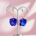 Detail of dark blue matte petal earrings with gold hexagonal hooks on a silver stand - Dark Blue Style (A1168)