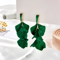Macro detail of vintage dark green floral petal earrings with layered matte finish texture - Holographic Green