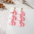 Detailed view of layered pink petal long earrings with gold heart-shaped studs on white - Pink (A1218)