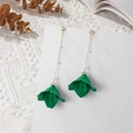 Detail of long pearl chain earrings with dark green flower petals on a white display - Deep Green (A1204)