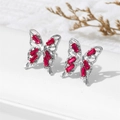 Silver butterfly stud earrings with magenta zircon stones on a gray display stand - Rose Red (A1560)