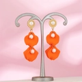 Detailed macro of vintage orange petal earrings with pearls and gold-tone finish - Orange Red (A1386)