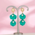 Detail of vintage style drop earrings featuring green petals and white pearls on pink silk - Lake Green (1389)
