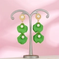 Close-up of green petal drop earrings with pearls on a silver jewelry stand - Emerald Green (A1390)